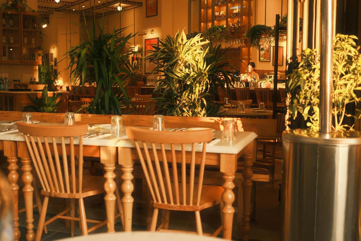 Inside of a southern restaurant showing two chairs tucked beneath a table