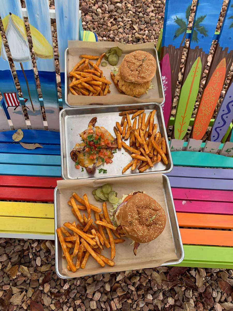 trays of burgers and fries