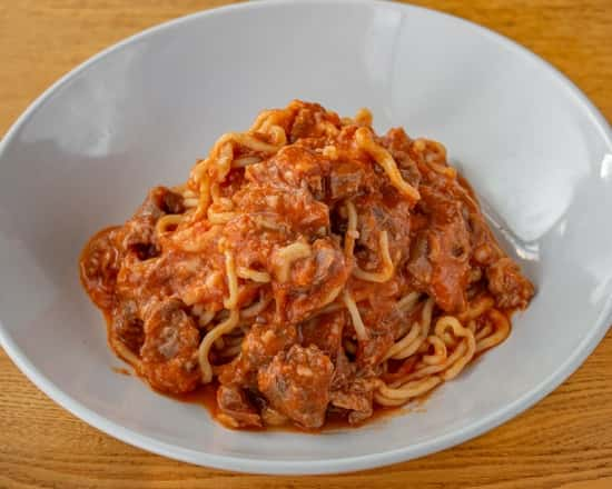 Tagliatelle Al Cighiale tossed in the Parmigiano Reggiano wheel