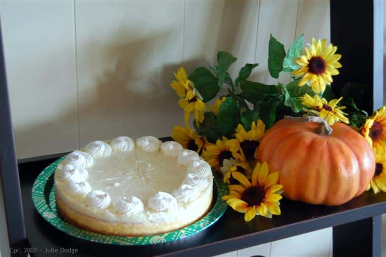 Pie and fall decorations on black shelf
