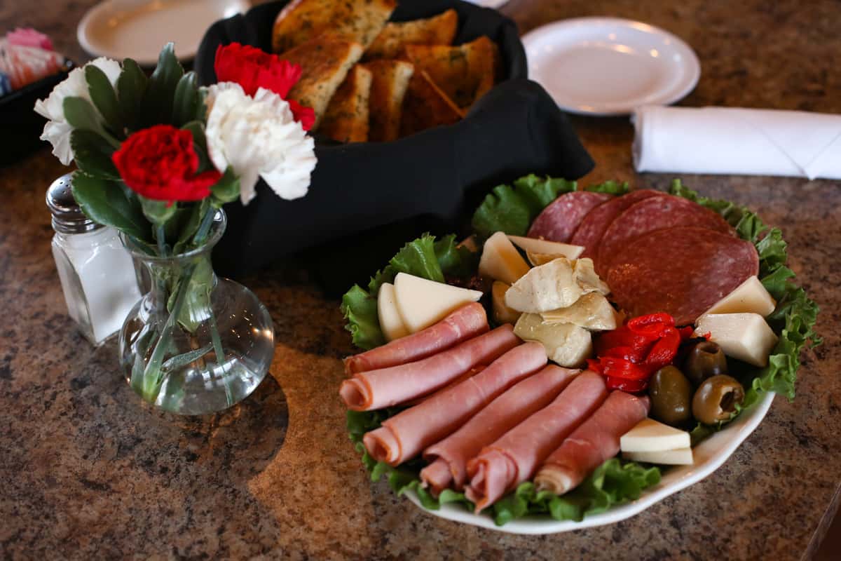Volpi salami, prosciutto ham, cheeses, artichoke hearts and olives