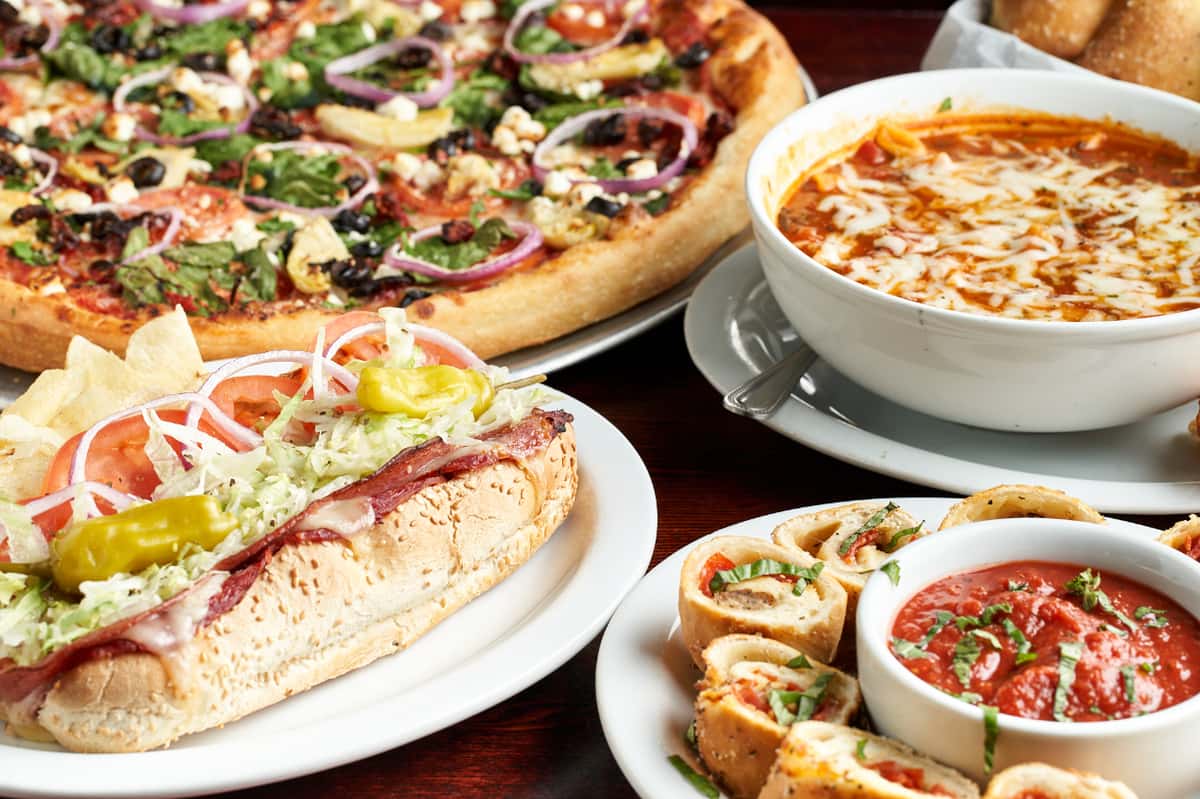 Pizza with minestrone soup, pizza rolls and a sub prepared at Streets of New York