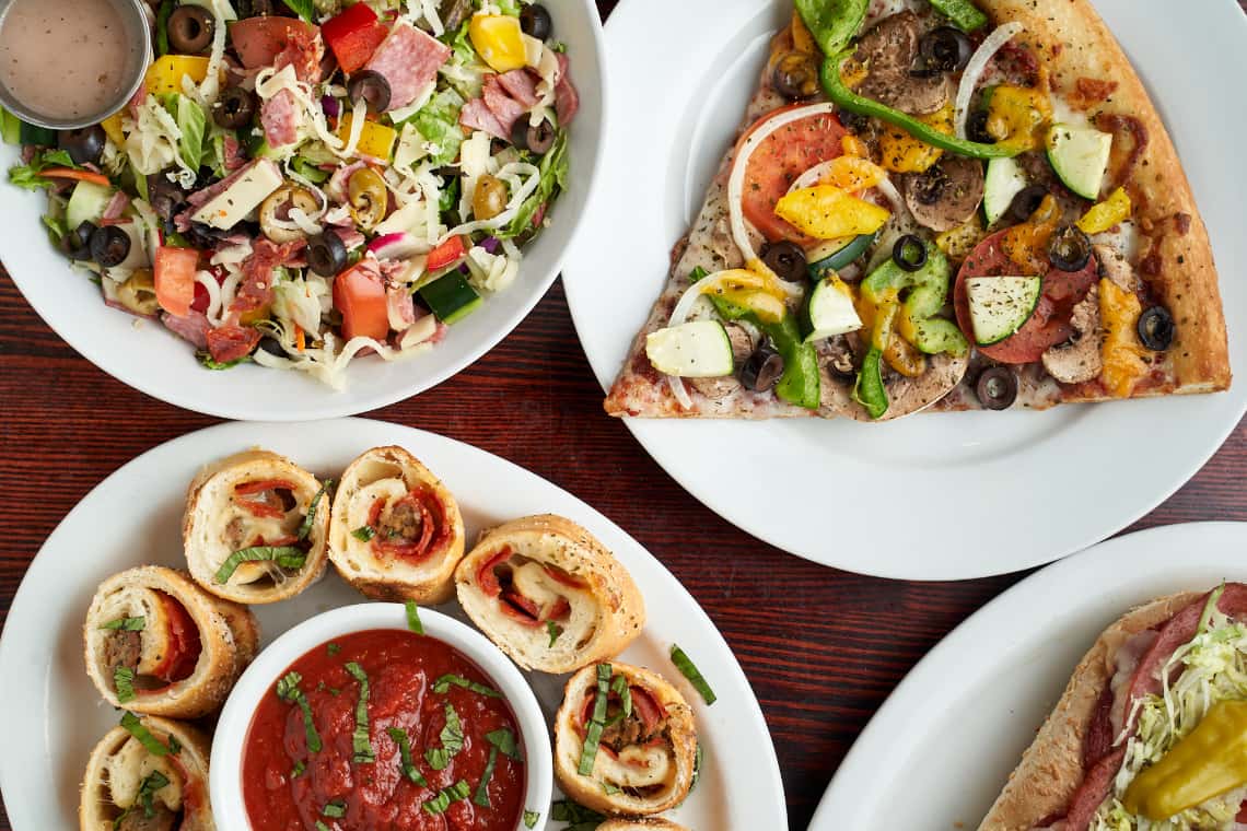 salad, pizza roll ups and pizza slices