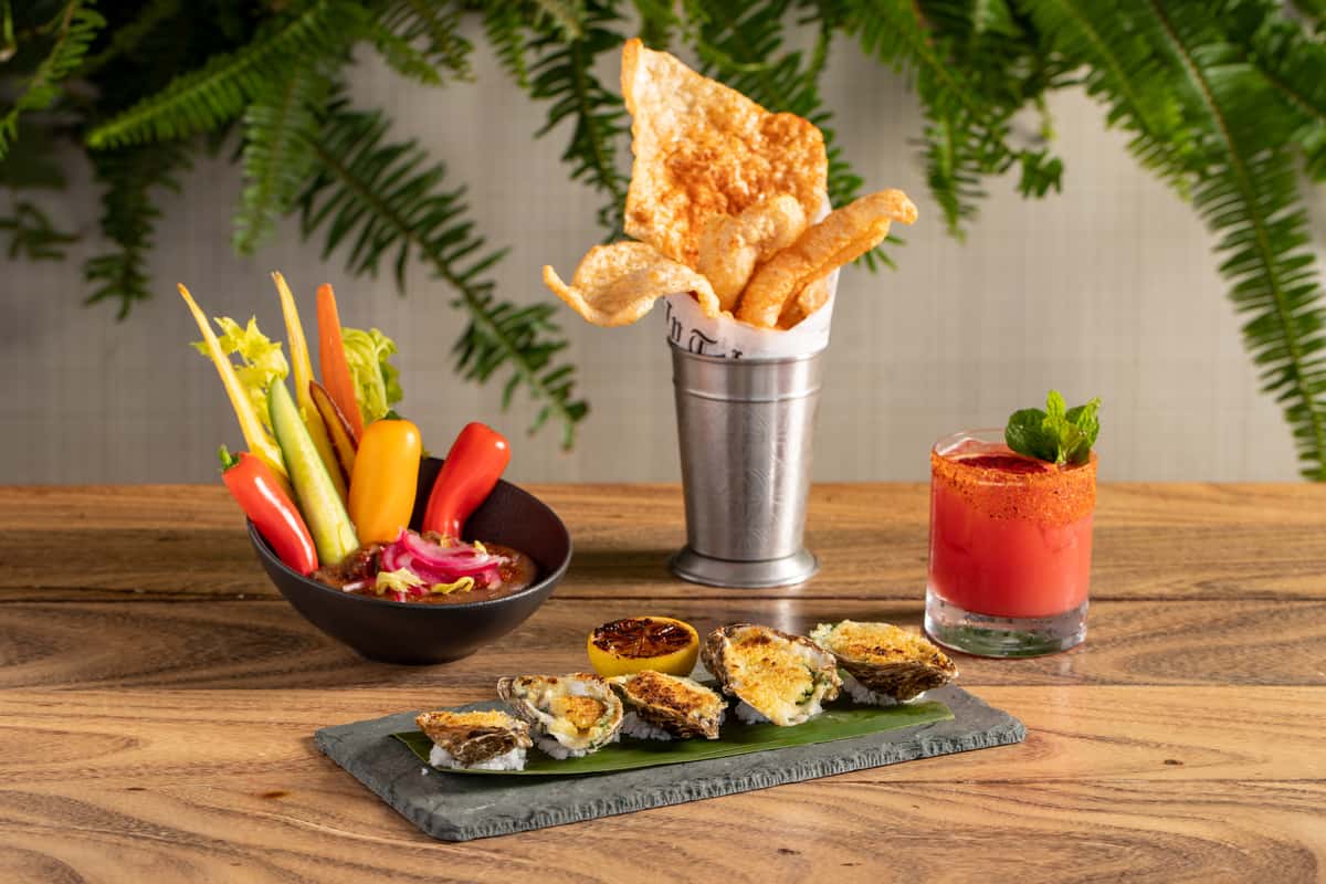 veggie platter, cocktail, and appetizer on a plate