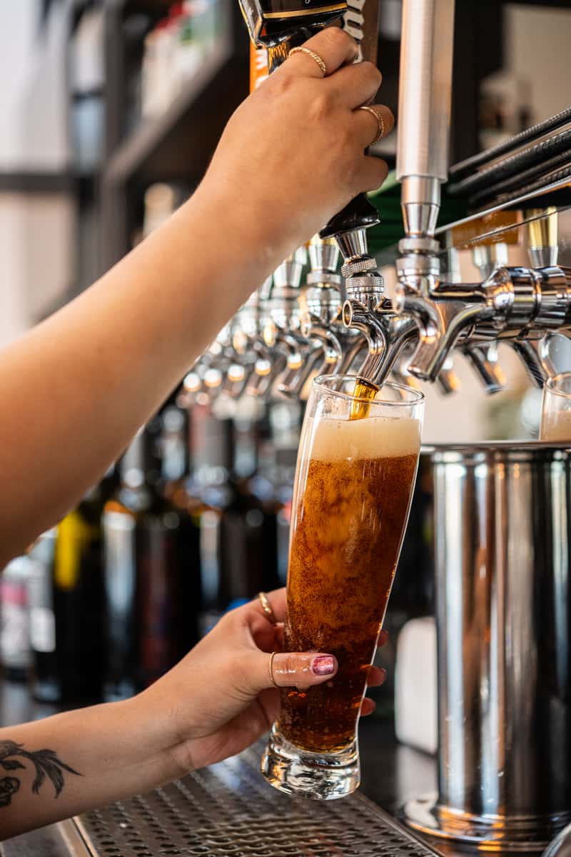 beer being poured from tap