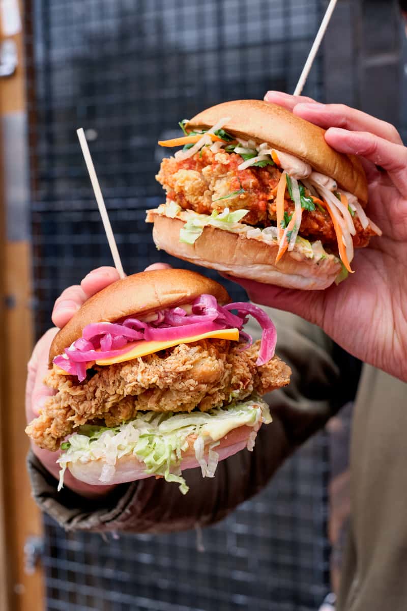 CHICK N SOURS BURGERS IN HAND