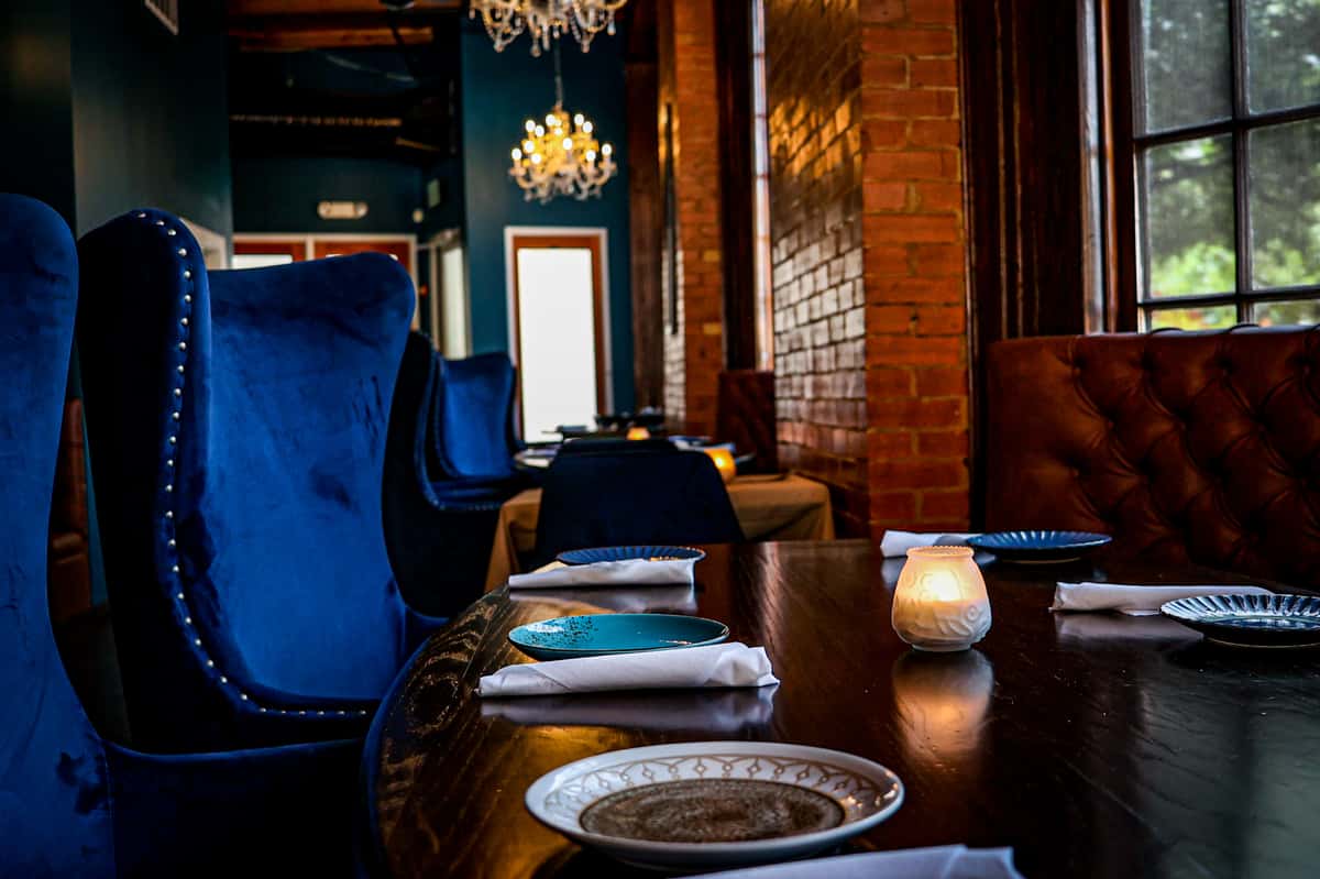dining table with blue velvet seating