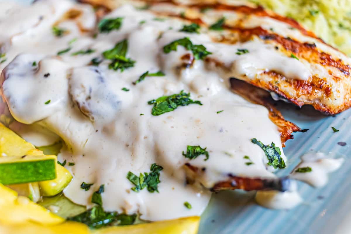 A beautifully plated grilled chicken dish, a representation of Chet's elevated culinary style.