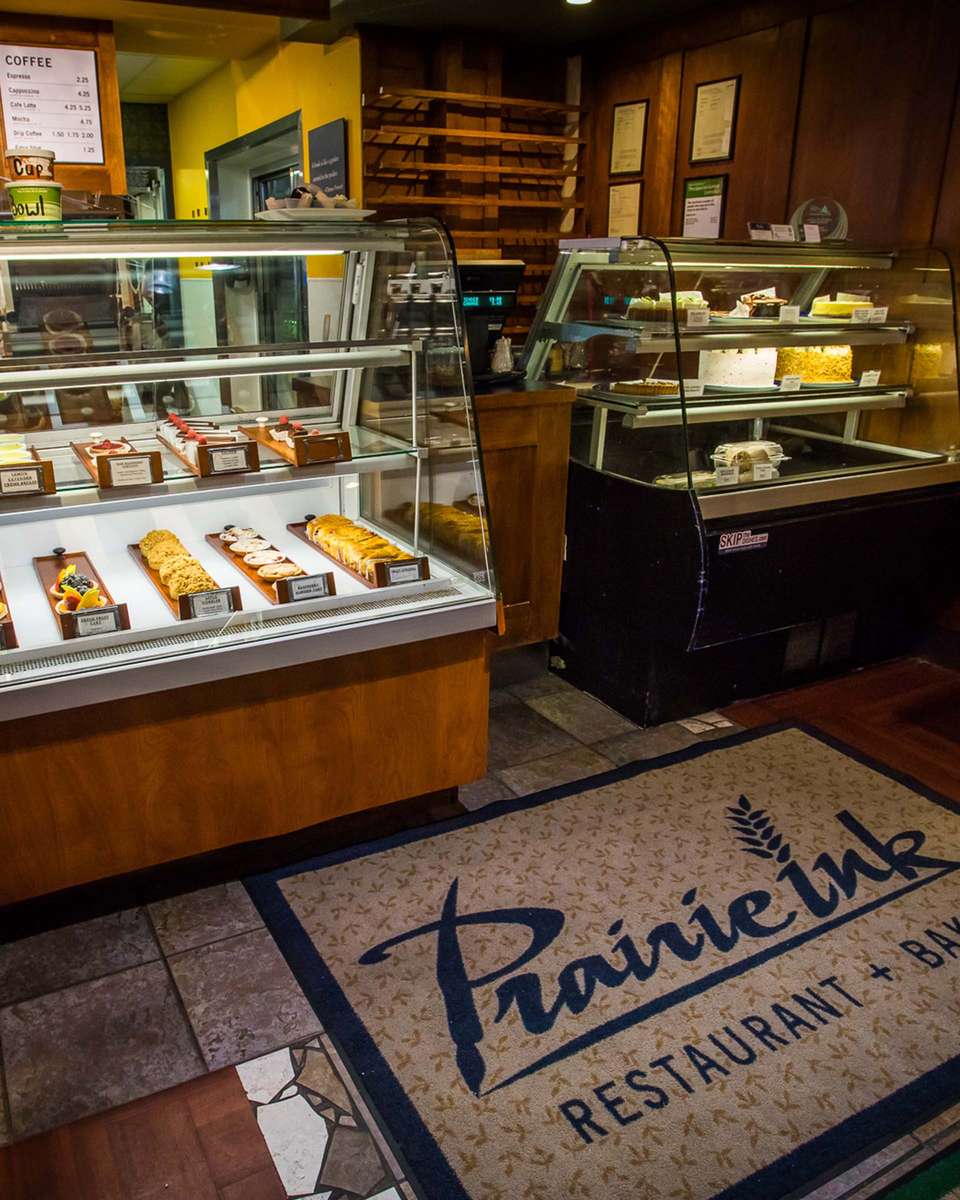 Interior shot of the pastry store with the fridges of several pastries