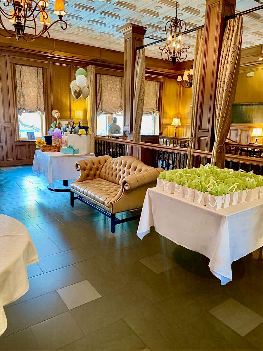 Photo showing welcome tables for a shower in the upstairs Upham Room at Rising Eagle.
