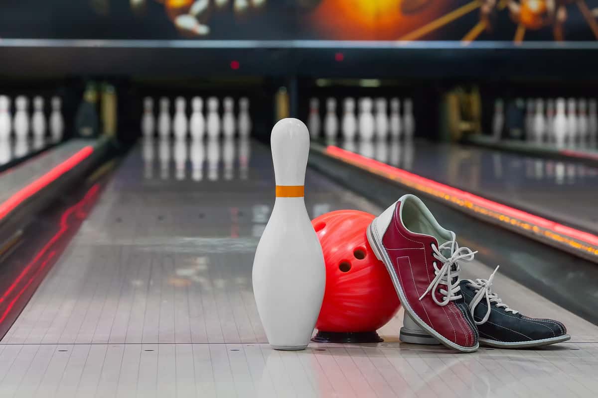 bowling ball, bowling shoes and pin