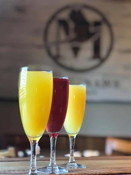 three mimosas on bar top