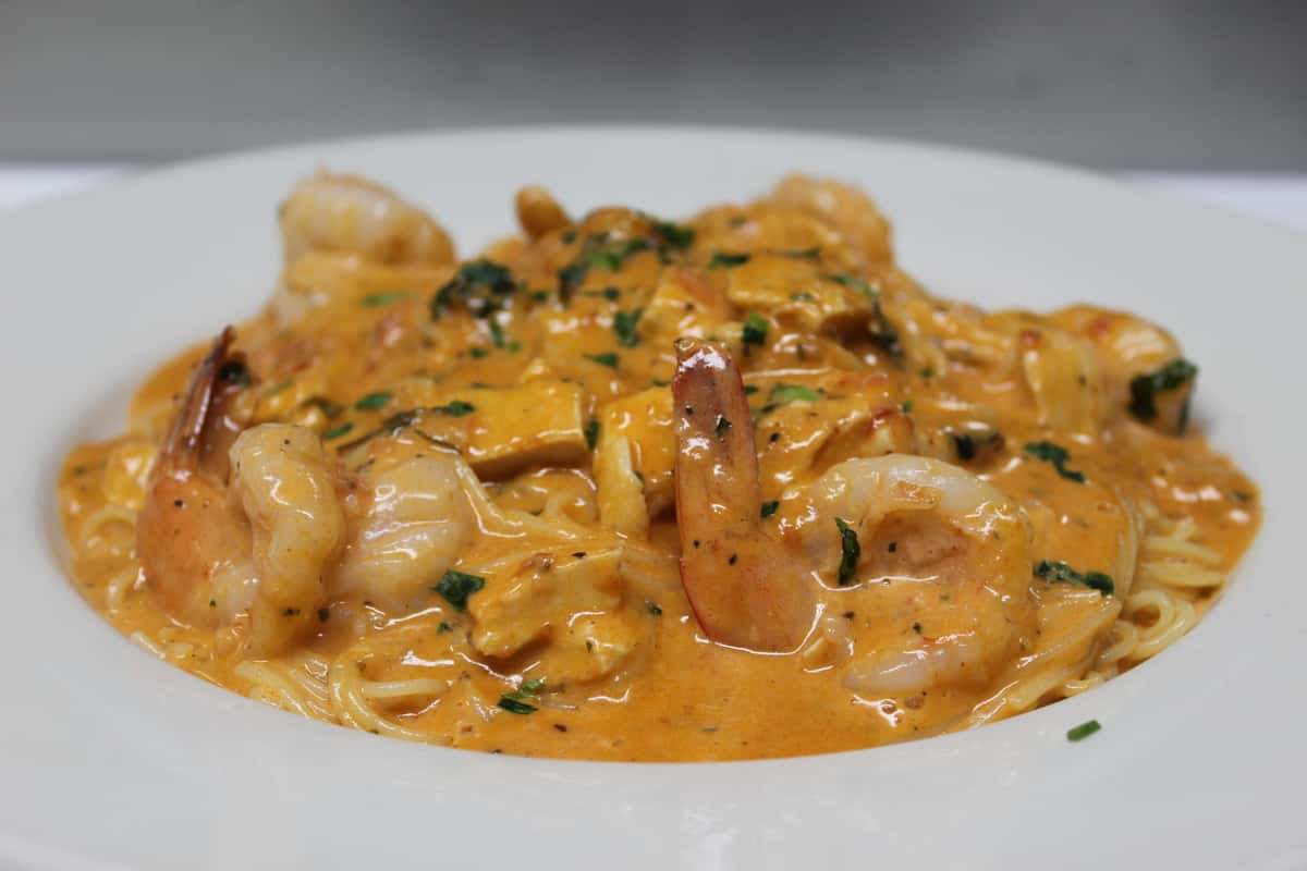 Prepared with chicken and shrimp in a creamy tomato sauce
