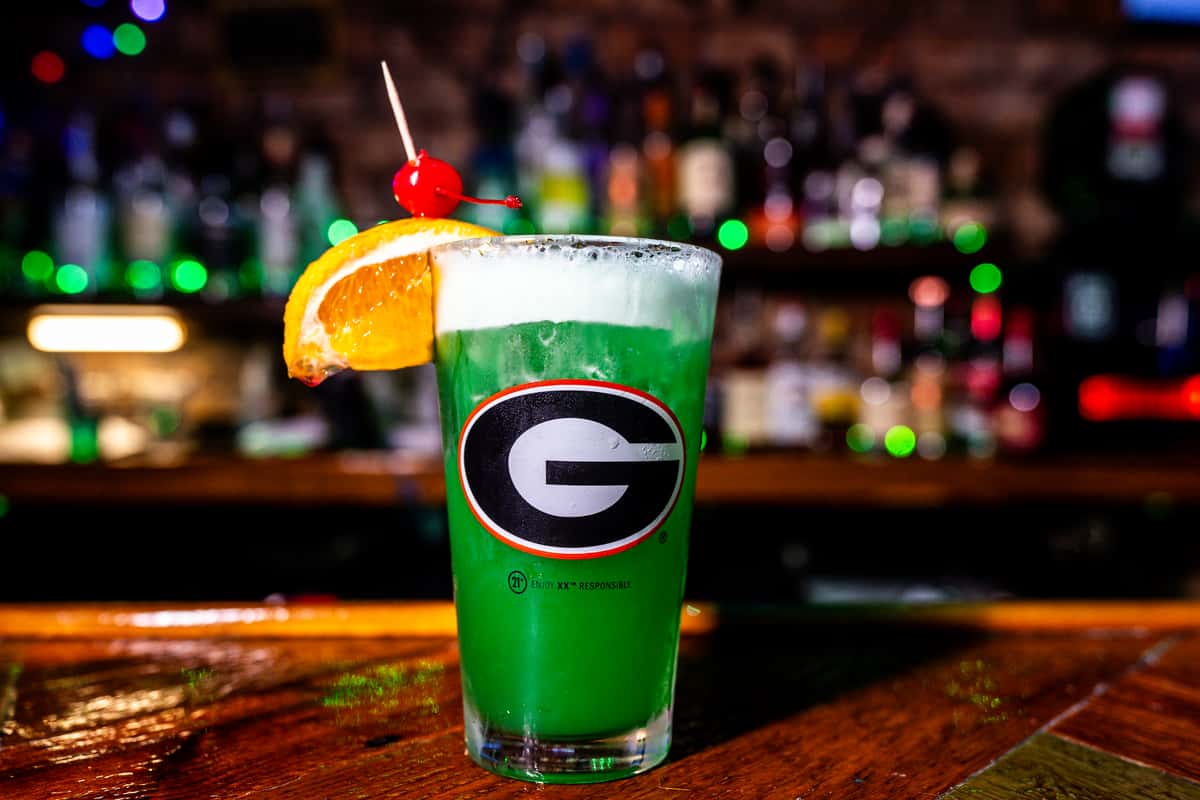 Green drink with an orange slice