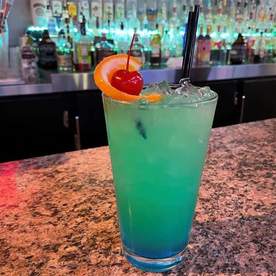 alcoholic drink with an orange and cherry
