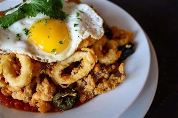 Fried calamari with a fried egg on top