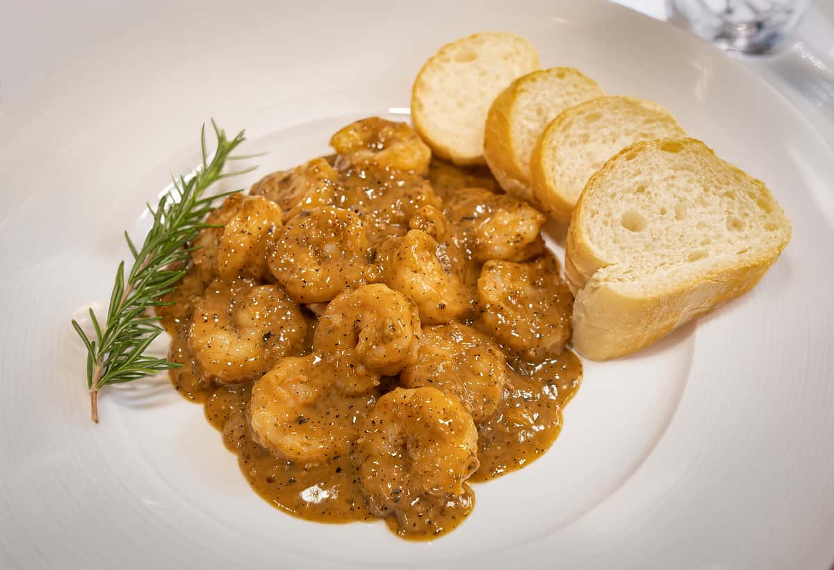 BBQ Shrimp on plate with french bread