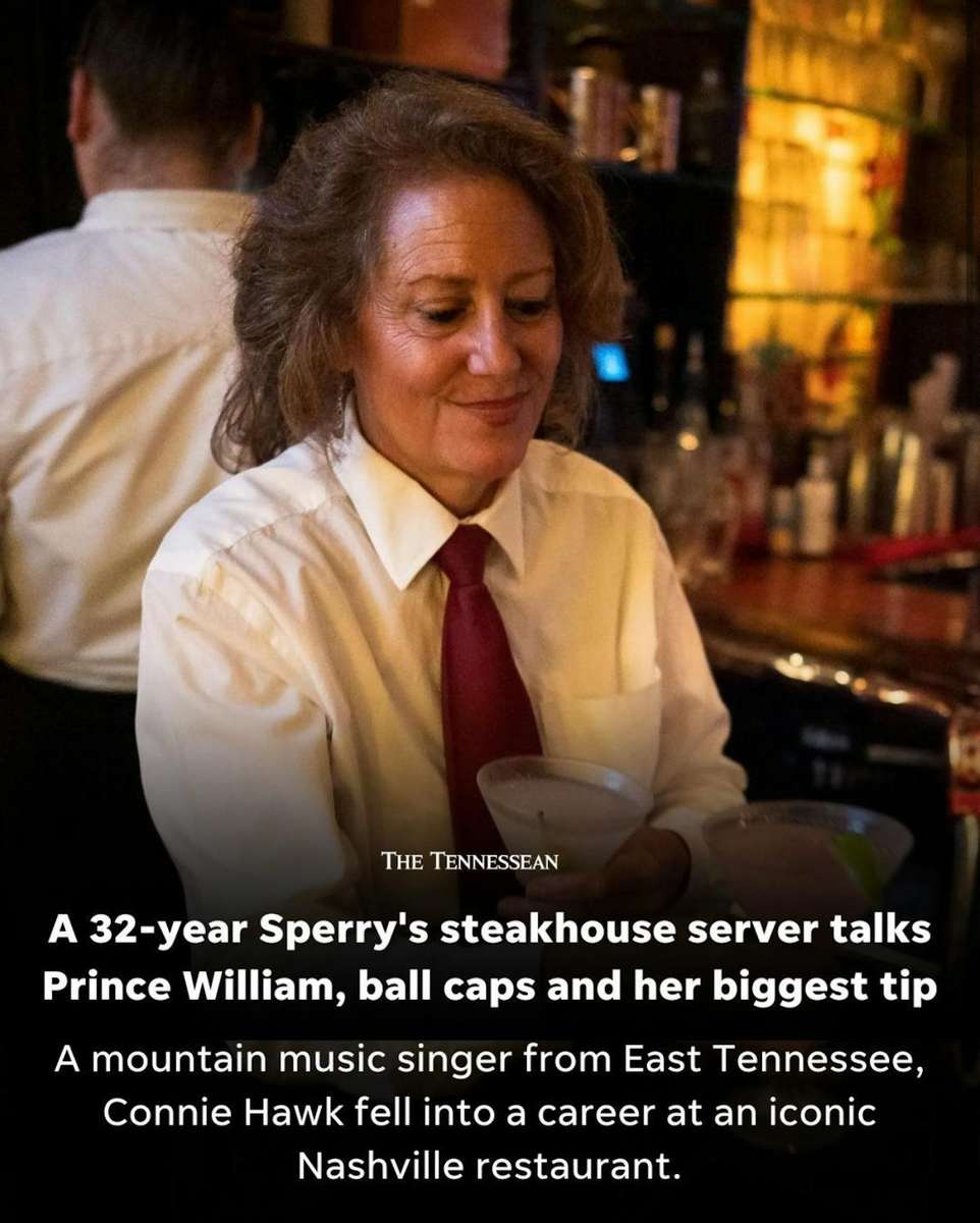 Professional bartender preparing drinks behind the bar at Sperry's Restaurant.