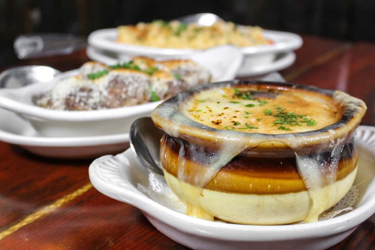 Classic French onion soup baked with melted cheese until golden brown.