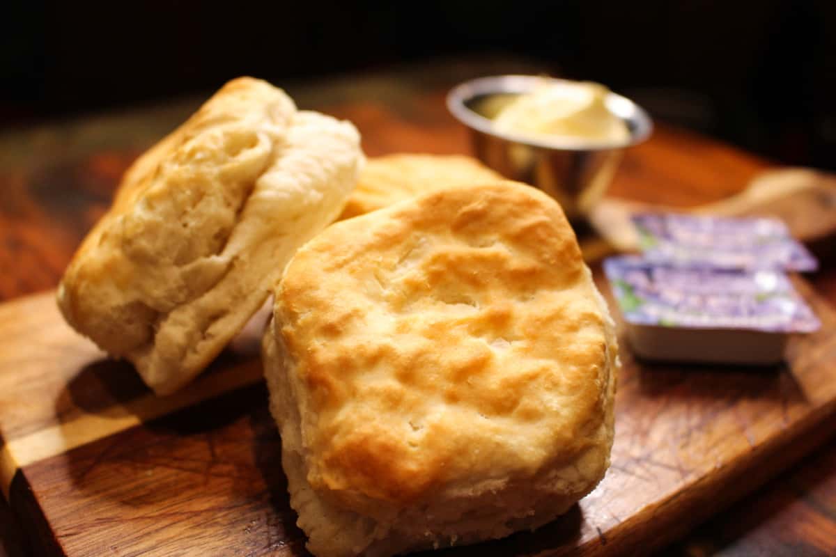 Freshly baked biscuits served warm with butter.