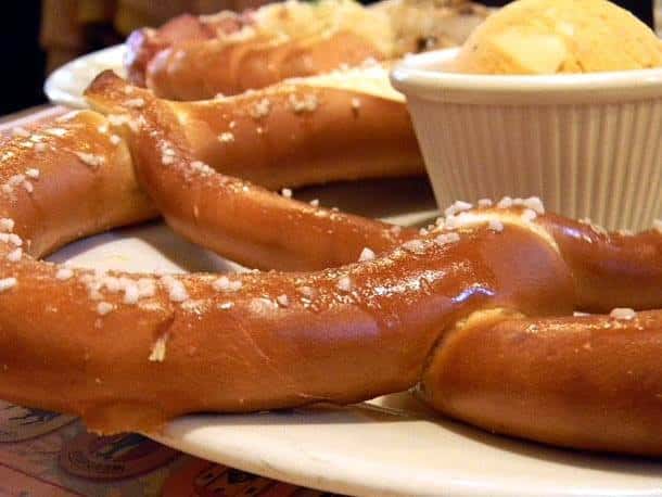 Soft pretzal on plate with dipping sauce