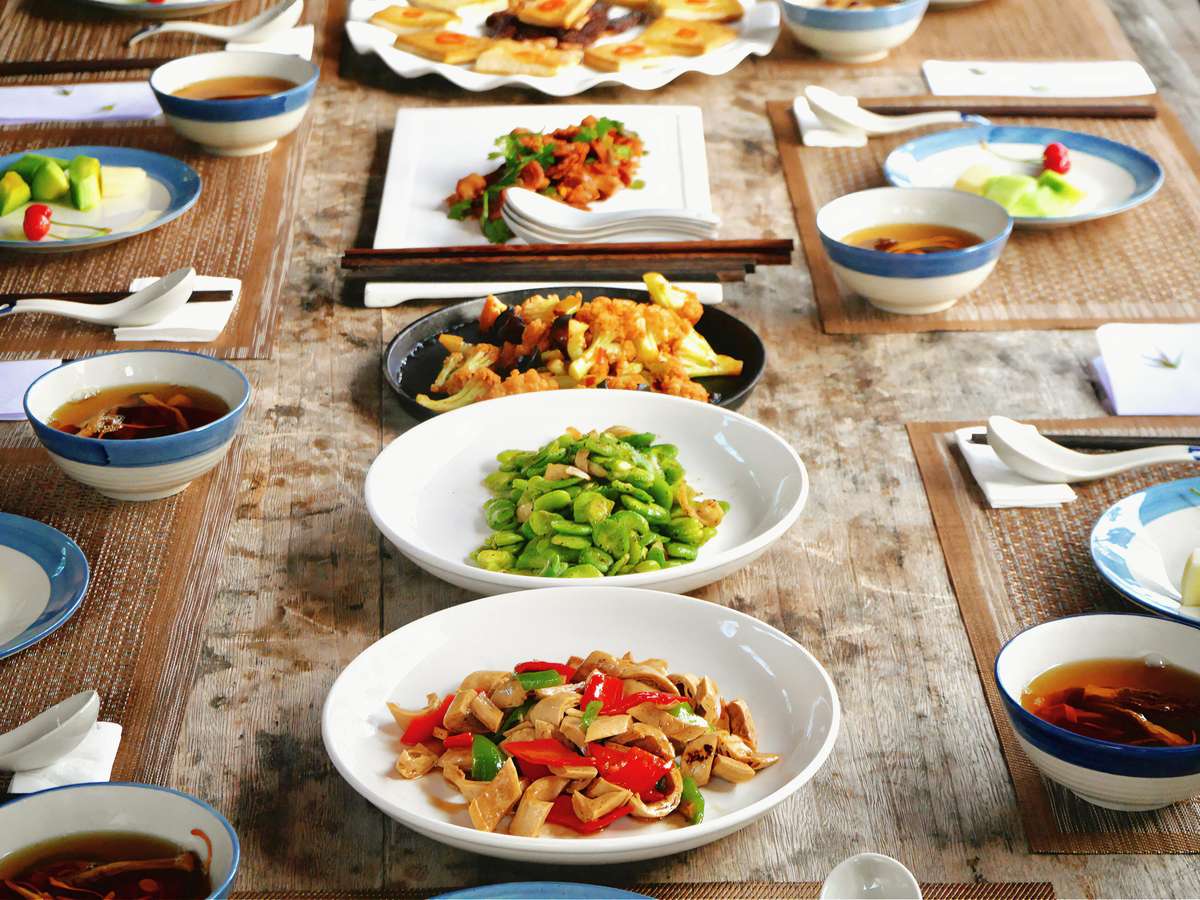 Variety of Cantonese dishes spread on the table.
