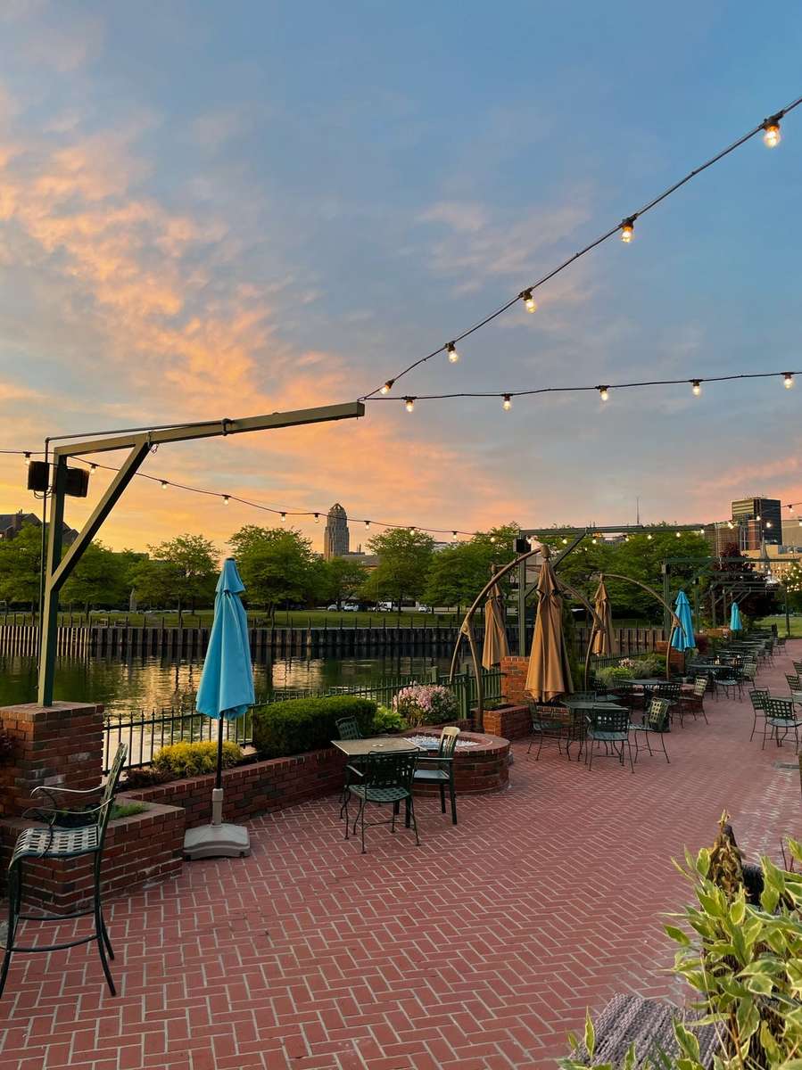 Outdoor patio venue space with sunset view and string lighting
