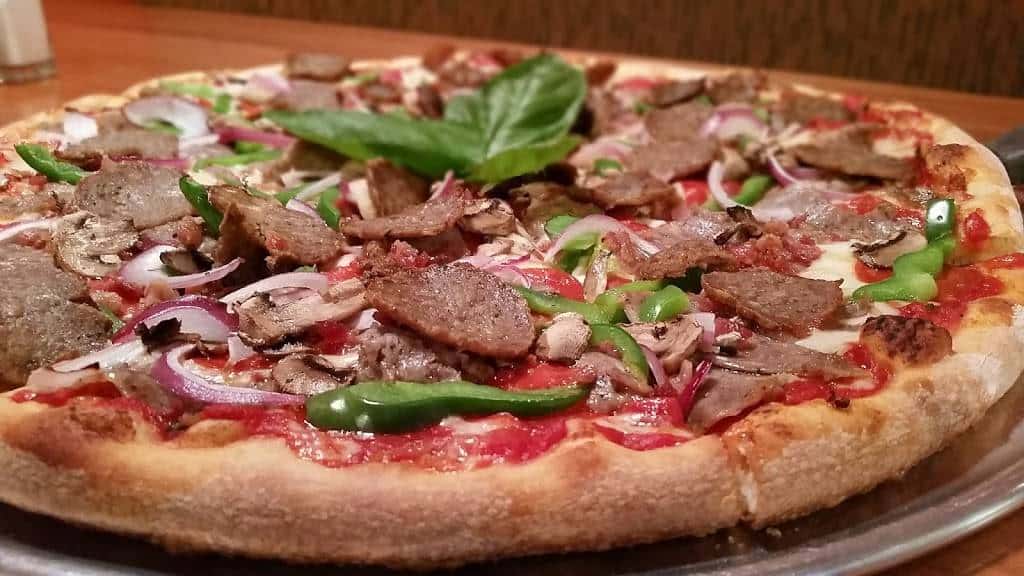 Pizza with meat and veggie toppings