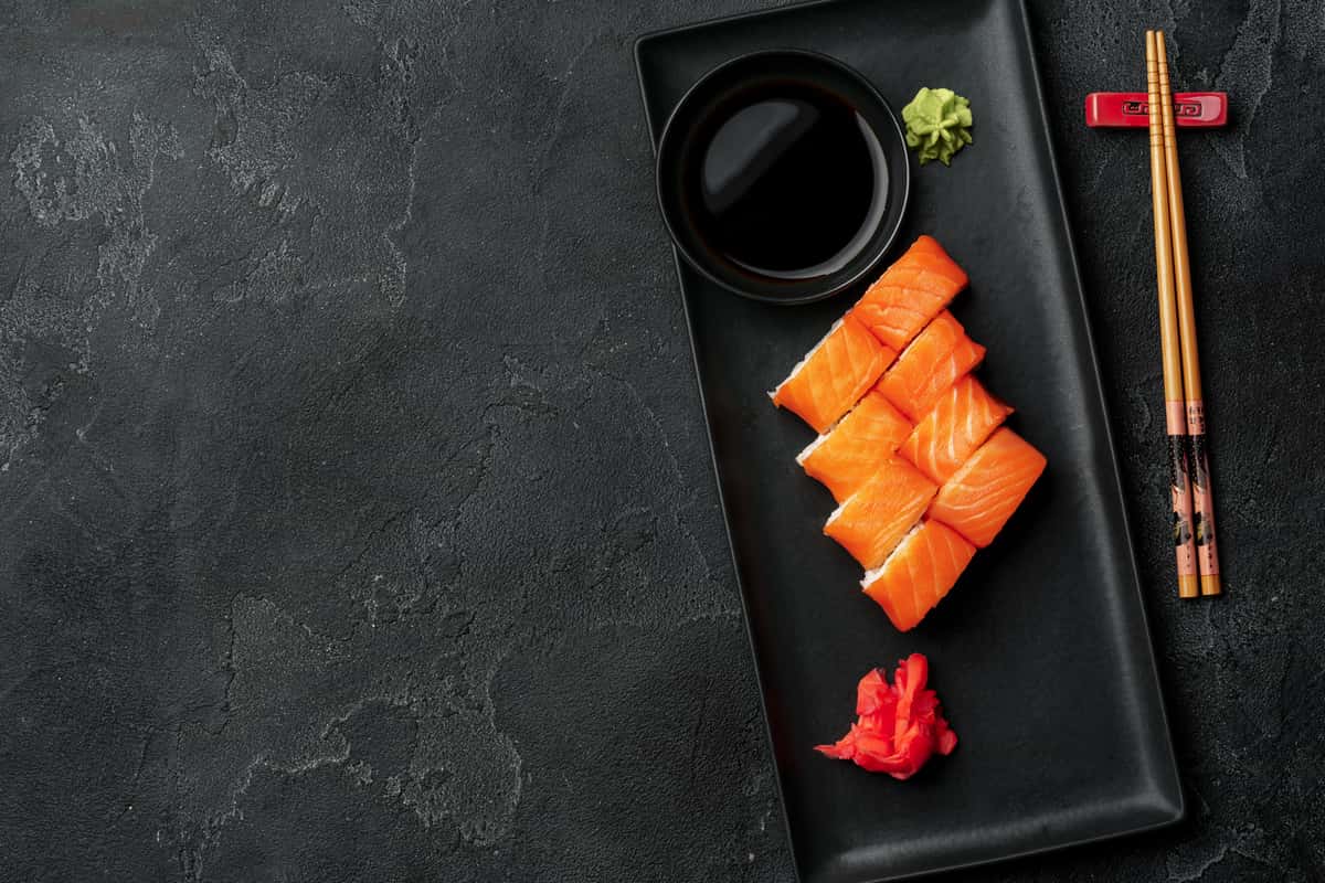 sushi rolls on black plate