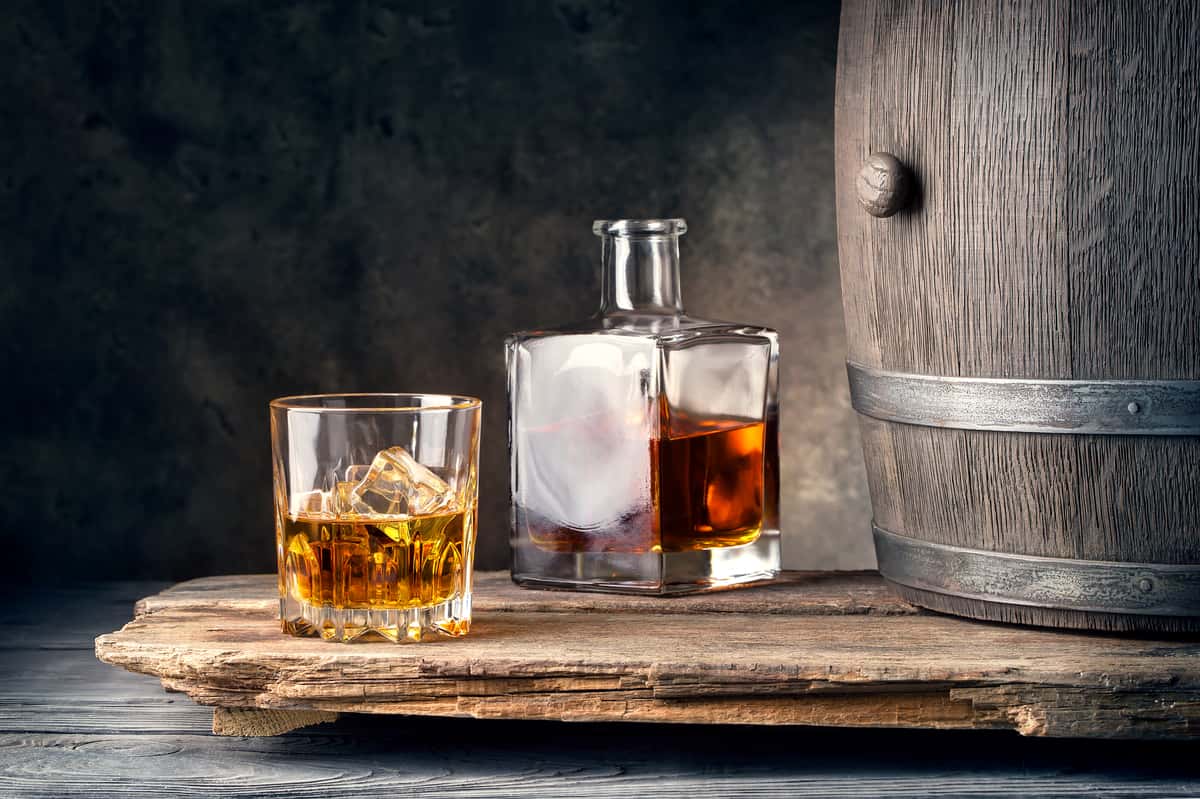 whiskey barrel with whiskey glasses