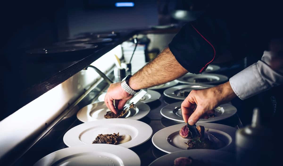 Chef plating numerous plates
