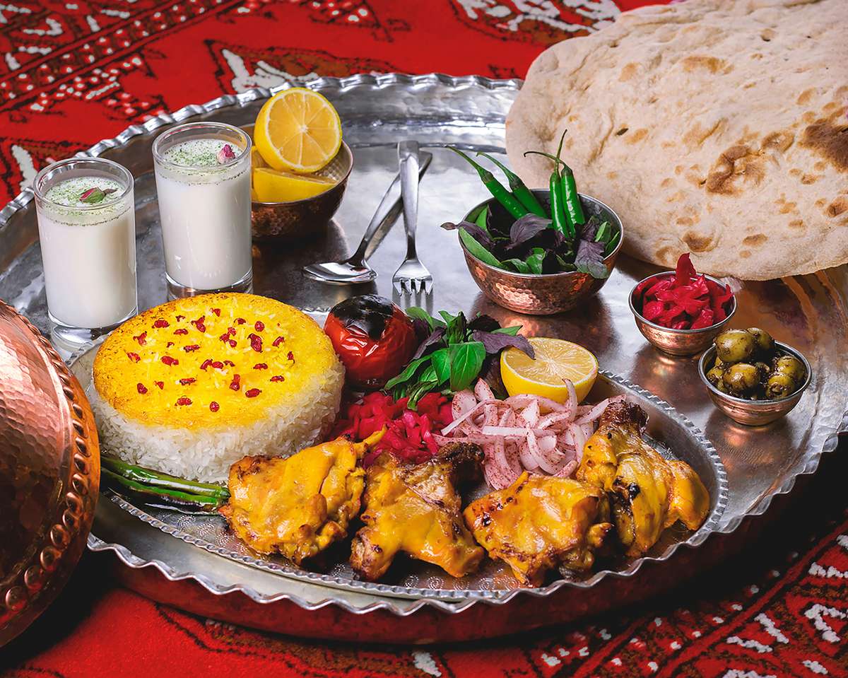 A tray of Indian food and sides