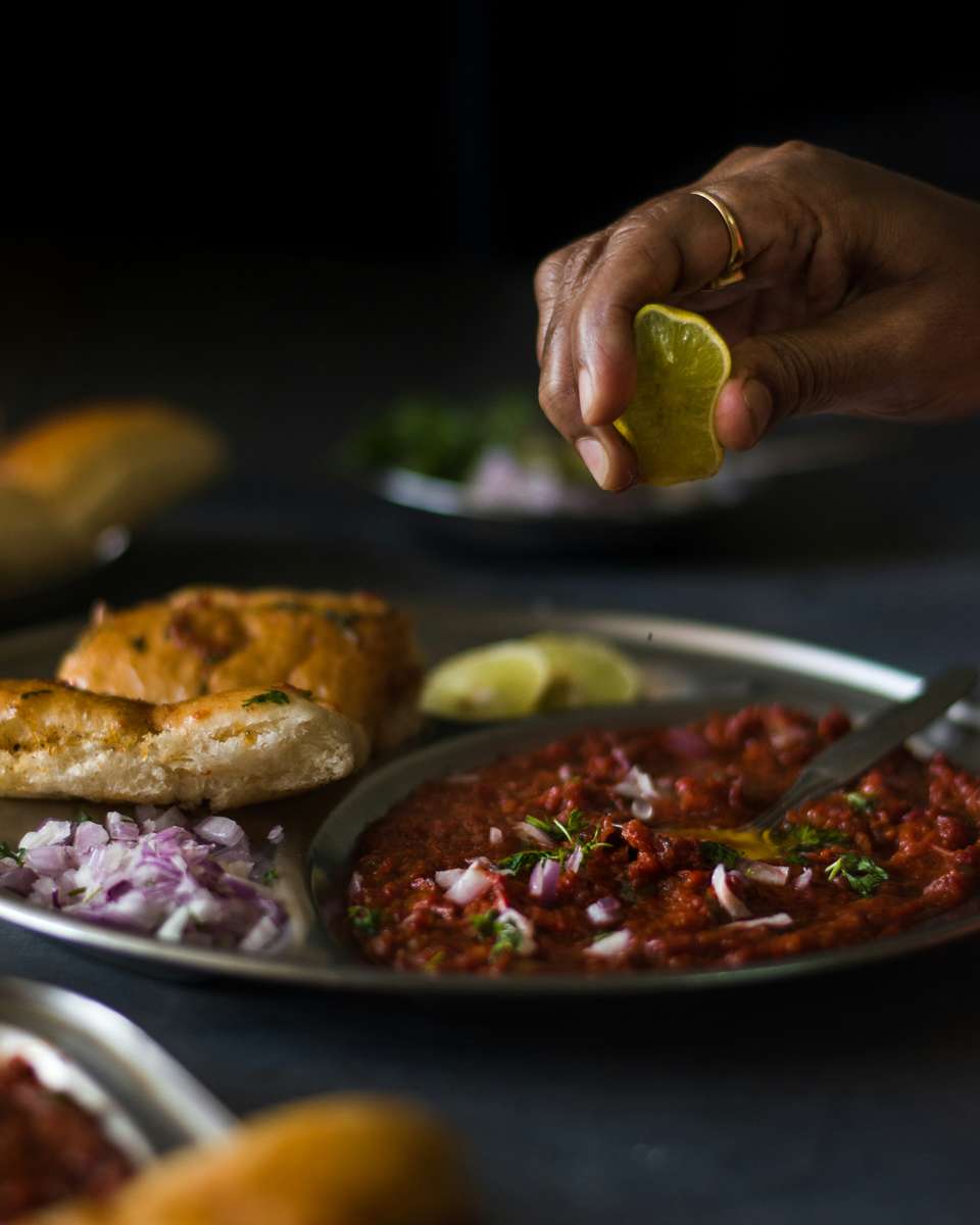 Indian food having lemon squeezed over