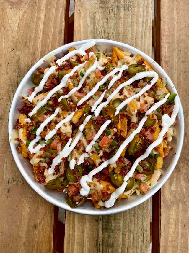 crispy waffle fries, topped w/queso blanco, bacon, pickled jalapenos, salsa, sour cream *add seasoned beef, chicken, or chili for $5