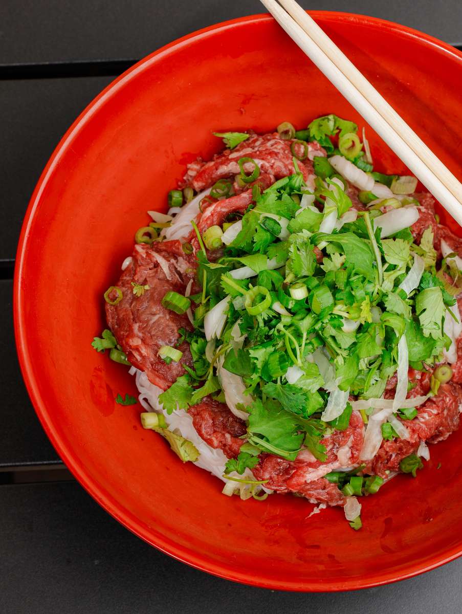 meat, spring onion, parsley and noodles