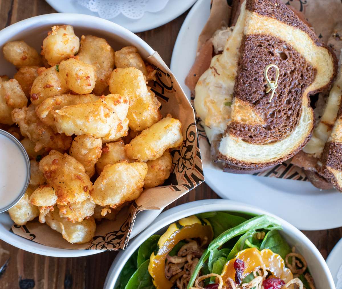 cheese curds, salad and sandwich