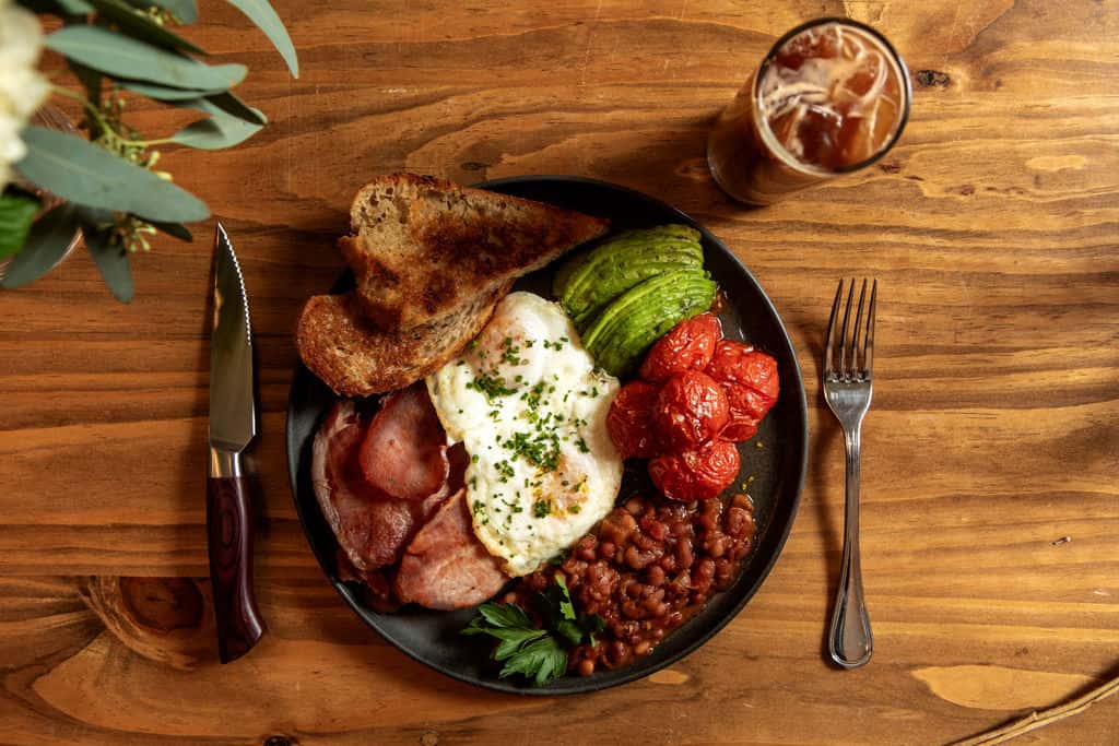 folded eggs, aussie bacon, vine tomatoes, sliced avo, baked beans served w/ fresh sourdough toast
