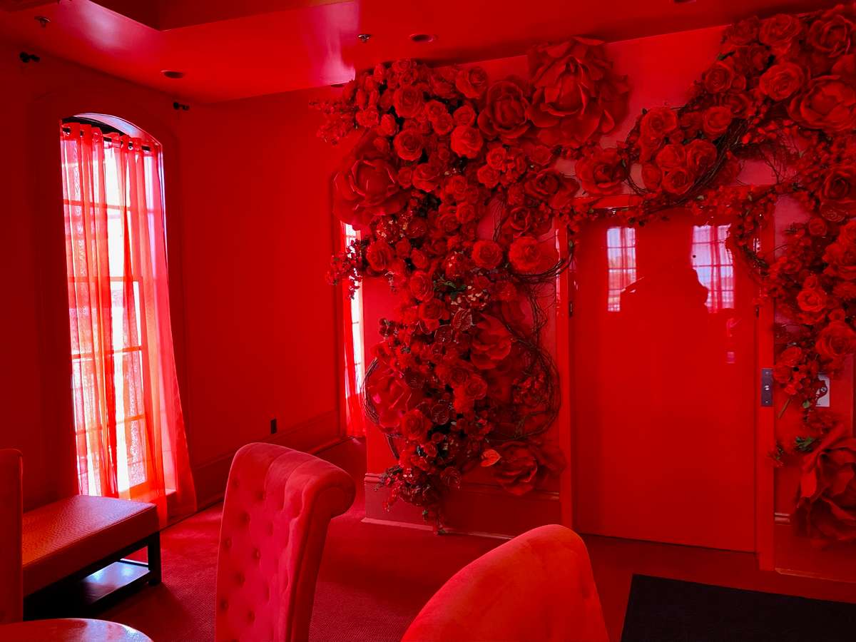 Picture of the entrance door with flowers decoration at the red light district