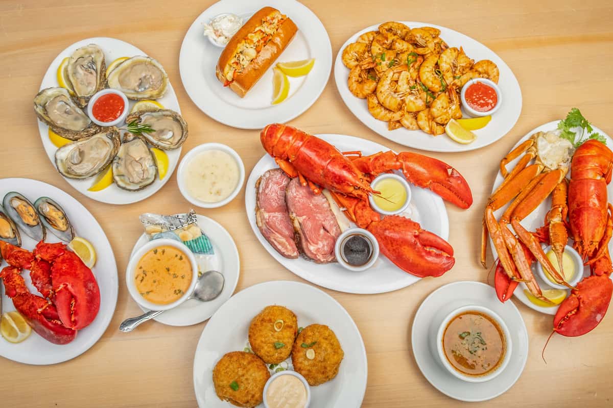 Assortment of dishes including lobster, crabcakes, oysters and more