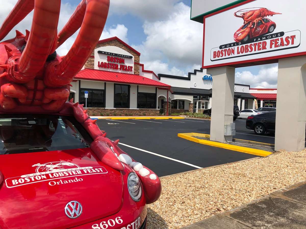 Exterior of Boston Lobster Feast with the Lobstermobile parked in front of the restaurant