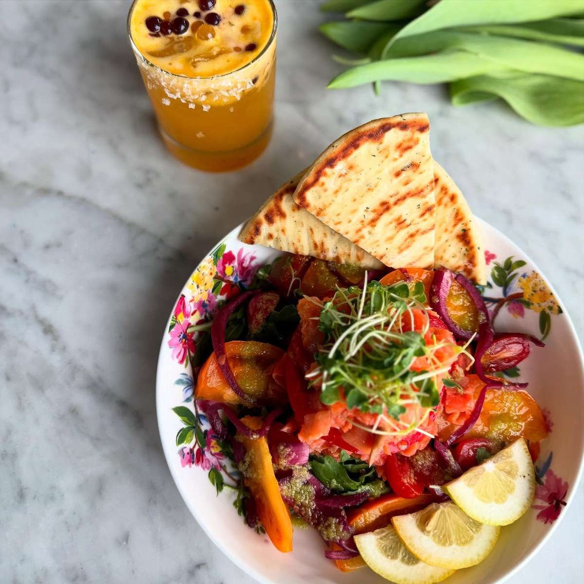 Smoked Salmon Salad with heirloom tomatoes, hibiscus pickled onions, and preserved lemon vinaigrette