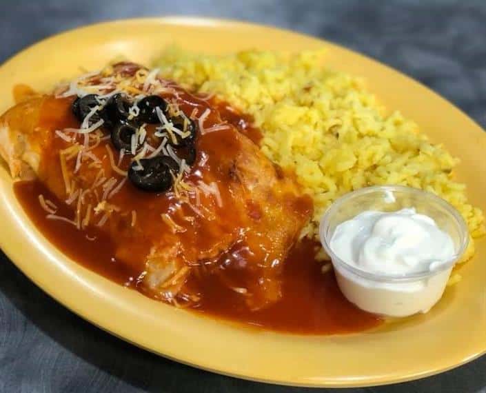 western omelette with rice and sour cream on the side.