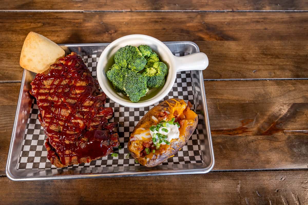 rib dinner with baked potato