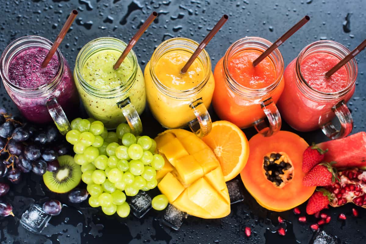 variety of fruits and juices in mason jars