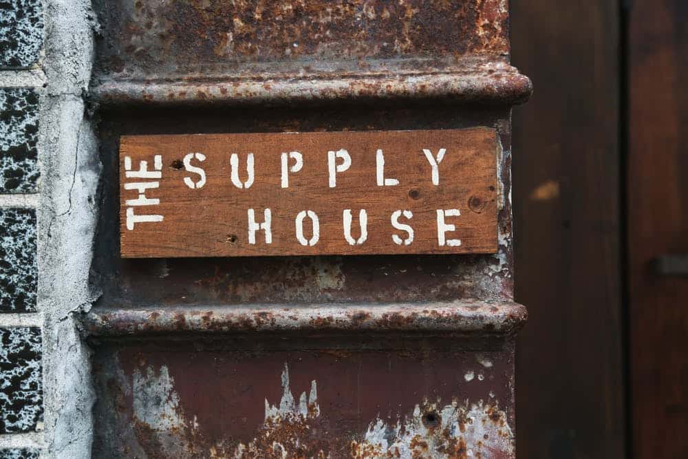 outdoor supply house wooden sign