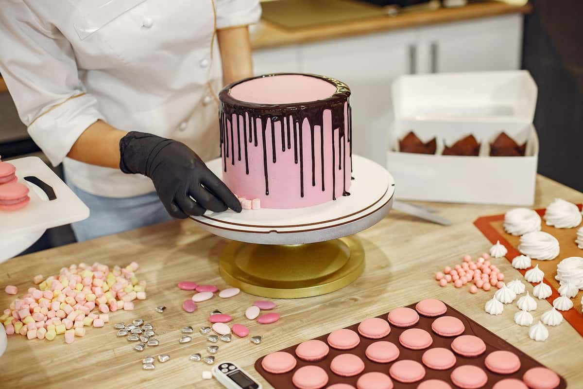 Decorating a cake in a professional kitchen