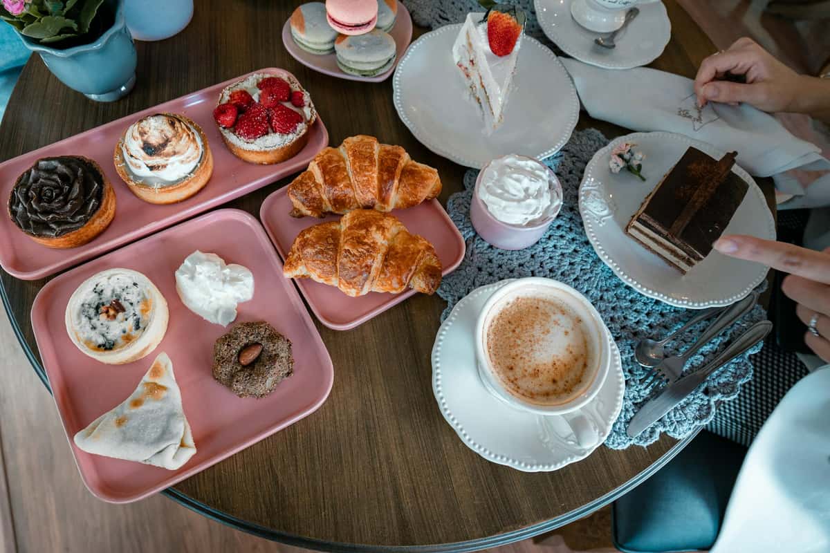 Above view of multiple plates with pastries on them