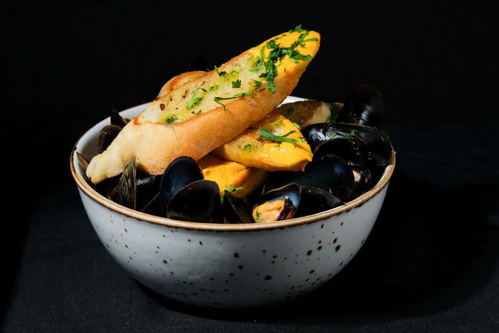 White wine cream, rouille, chive oil, and grilled baguette