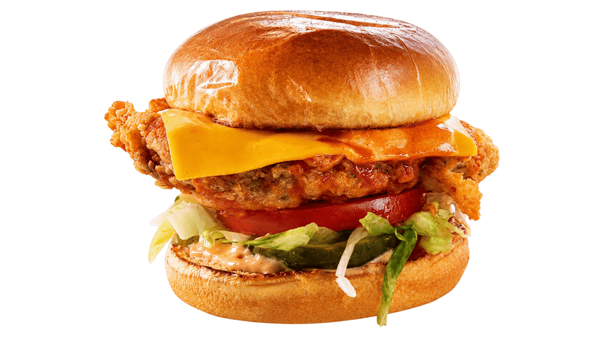 Crispy chicken sandwich topped with fresh vegetables