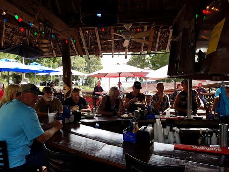 people sitting at bar inside cherry pocket